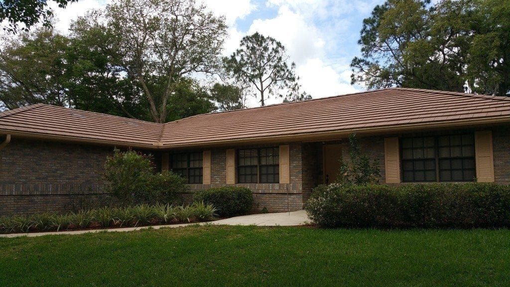 Is Your Roof Under Attack? Roofs in Lakeland and the rest of Florida present the perfect living quarters for algae, moss, and other mold. The worst culprit is a type of bacteria called Gloeocapsa Magma. It creates black streaks across your roofing – and as it eats the limestone in your shingles, it spreads. The result is ugly and dangerous. Without regular cleaning, this bacteria will deteriorate your roofing. Algae growth on the roof can lead to premature granule loss. It makes your roof to appear much older than it is, and it creates issues that cost money and take time to fix. No roofing material is safe from this kind of wear and tear: It affects asphalt roofing, slate, metal, and tile roofs alike. Here’s the good news. There is an alternative. A professional roof cleaning will restore the original appearance of your roof and keep it from declining prematurely.