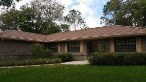 Is Your Roof Under Attack? Roofs in Lakeland and the rest of Florida present the perfect living quarters for algae, moss, and other mold. The worst culprit is a type of bacteria called Gloeocapsa Magma. It creates black streaks across your roofing – and as it eats the limestone in your shingles, it spreads. The result is ugly and dangerous. Without regular cleaning, this bacteria will deteriorate your roofing. Algae growth on the roof can lead to premature granule loss. It makes your roof to appear much older than it is, and it creates issues that cost money and take time to fix. No roofing material is safe from this kind of wear and tear: It affects asphalt roofing, slate, metal, and tile roofs alike. Here’s the good news. There is an alternative. A professional roof cleaning will restore the original appearance of your roof and keep it from declining prematurely.
