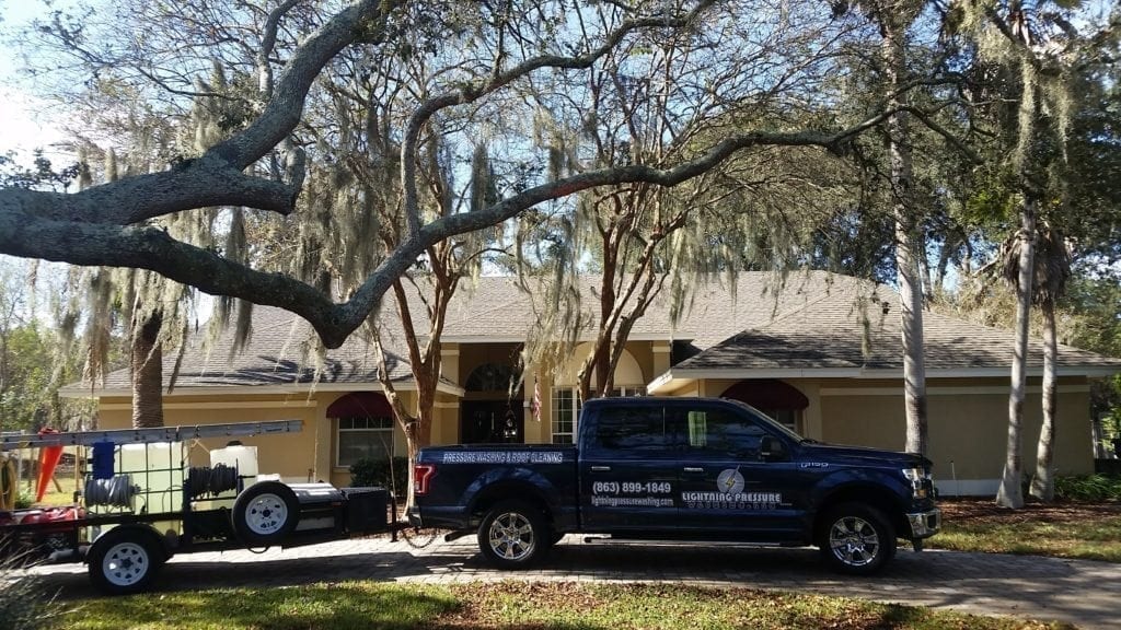 lightning pressure washing truck after roof cleaning job