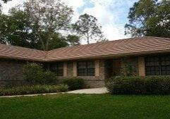 Is Your Roof Under Attack? Roofs in Lakeland and the rest of Florida present the perfect living quarters for algae, moss, and other mold. The worst culprit is a type of bacteria called Gloeocapsa Magma. It creates black streaks across your roofing – and as it eats the limestone in your shingles, it spreads. The result is ugly and dangerous. Without regular cleaning, this bacteria will deteriorate your roofing. Algae growth on the roof can lead to premature granule loss. It makes your roof to appear much older than it is, and it creates issues that cost money and take time to fix. No roofing material is safe from this kind of wear and tear: It affects asphalt roofing, slate, metal, and tile roofs alike. Here’s the good news. There is an alternative. A professional roof cleaning will restore the original appearance of your roof and keep it from declining prematurely.